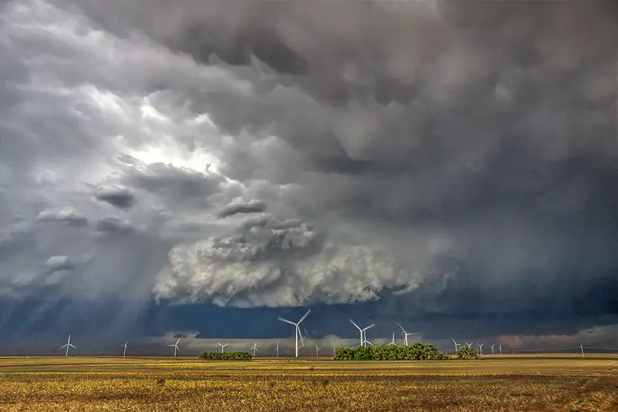 Stormy sky over a field of windmills