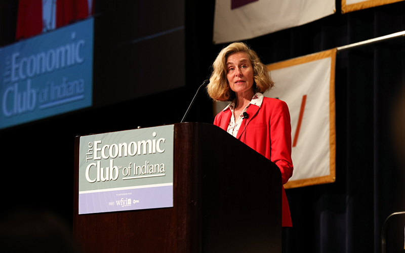 IU President Pamela Whitten speaks from a podium 