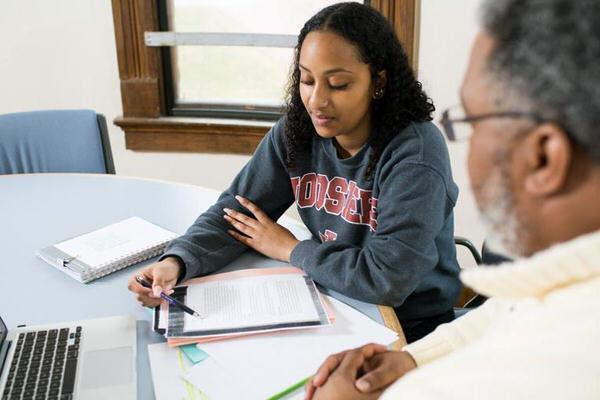 Student talking to her academic advisor.