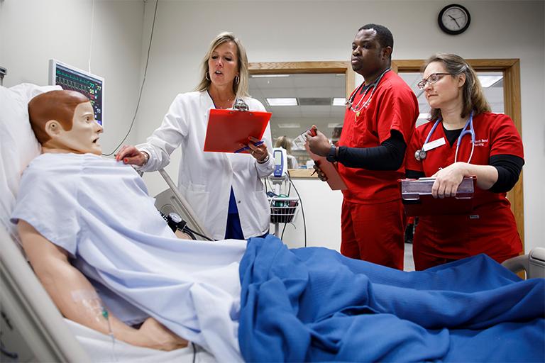 Nursing students working in the simulation lab at IU Kokomo.