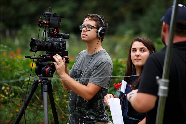 Students filming a video interview.