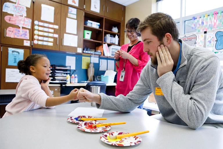 Education student working with a child. 