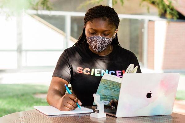 IUPUI student studying outside.