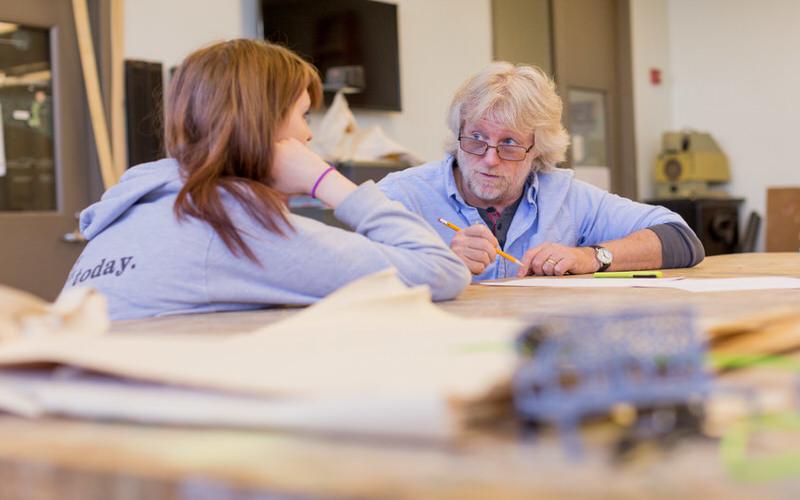 IU student works with a professor.