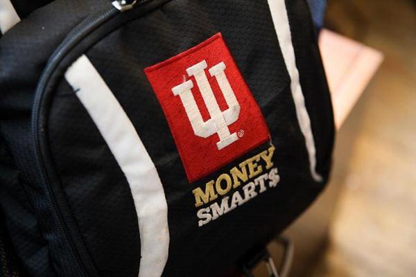 Bag with moneysmarts embroidered on it.