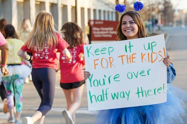 IU student encouraging dance marathon participants to keep going.