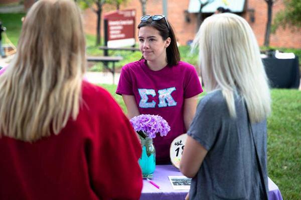 Three female students talking outside on IU Southeast campus.