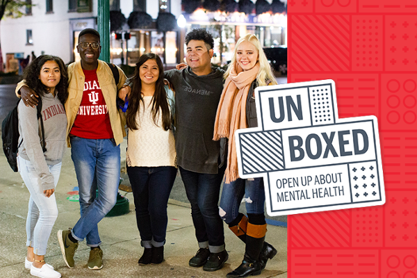 5 students stand on a public street with arms around each other. The students are smiling. The graphic reads unboxed, open up about mental health.